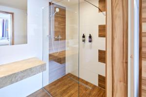 a shower with a glass door in a bathroom at Premier Inn Lindau in Lindau +34 photos