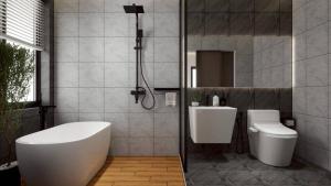 a bathroom with a tub and a toilet and a sink at Lanta Chaolay in Ko Lanta +54 photos
