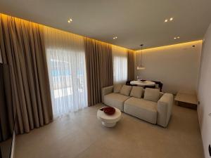 a living room with a couch and a table at Villa M in Neum +24 photos