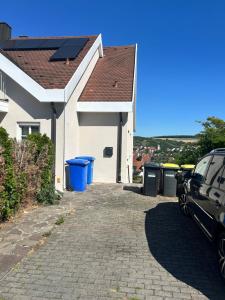 a house with a car parked in the driveway at Apartment in Rimpar in Rimpar