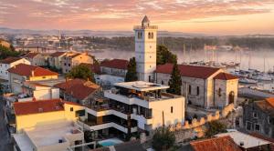 a view of a city with a clock tower at Basic Mansion Mandalina in Šibenik