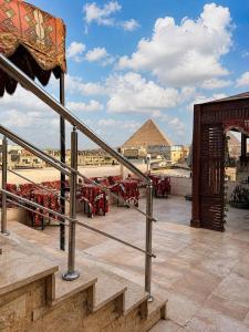 a view of the pyramids from the roof of a building at Egypt Aziz pyramids in Cairo
