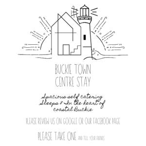 a lighthouse invitation for a wedding with a black and white at Buckie Town Centre Stay in Buckie