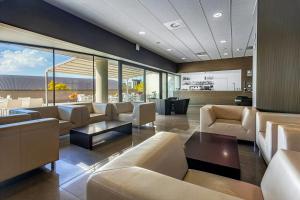 a large living room with couches and a table at Sercotel Hola Tafalla in Tafalla