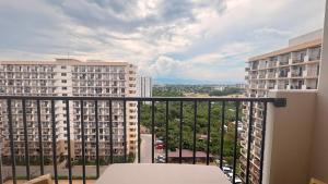 a balcony with a view of some buildings at 1403-304 Saekyung Pool view in Lapu Lapu City