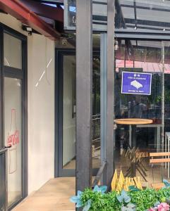 a building with a sign in front of a table at White Night in Skopje