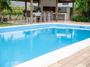 a swimming pool with blue water in a house at Paul René Manor House in Robertson