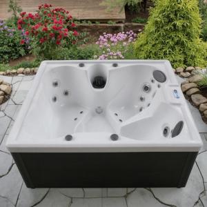 a white bath tub sitting on a patio with flowers at Rózsakő Ház in Badacsonytomaj +23 photos