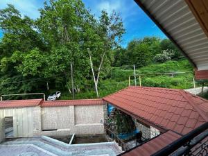 an overhead view of a house with a red roof at Yusubovs in Hacıkǝnd