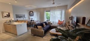 a living room with a couch and a table at Holiday - Comfort - Spacious - Escape in Grand-Baie