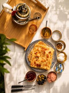 a table with a plate of food on a table at Dar Benyahya in Aït Zat