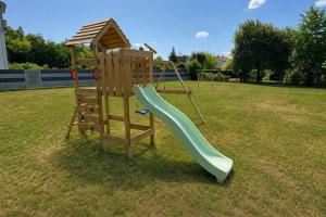 a playground with a slide and a play structure at Heimbi-Home No 3 I 4-6 Personen I EuropaPark I Family I Garten I Parkplatz I E-Ladestation in Kappel-Grafenhausen