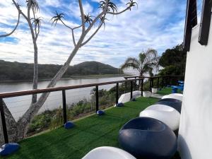 a balcony with a view of the river at Blues at Bonza Bay Beach in Beacon Bay