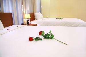 Rúm í herbergi á Danang Classic Hotel