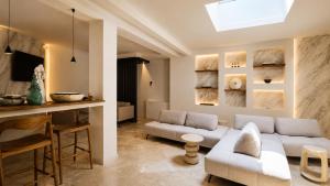 a living room with a couch and a table at Naim Boutique Hotel in Costa Rei