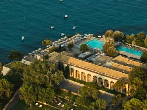 an aerial view of a building next to the water at Atlantica Grand Mediterraneo Resort - Adults Only in Kompítsion