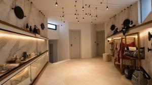 a hallway of a store with a long room with lights at Naim Boutique Hotel in Costa Rei