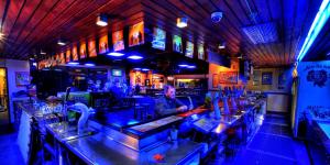 a bar with people sitting at the bar at Overlander Hotel in Mount Isa