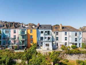 a group of colourful houses on a hill at Panoramic harbour views Morva in Falmouth