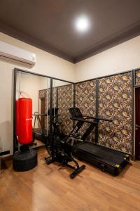 a room with a gym with a red object in it at Fit Haus - A Boutique Hotel in Kolkata +18 photos