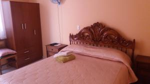 Cama ou camas em um quarto em Hostal Portales