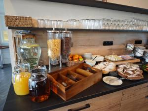 a kitchen counter with a tray of food on it at Pension Jezerná in Zduchovice