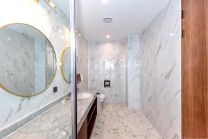 a bathroom with a sink and a mirror at Dyne Oceano Hotel in Jeju