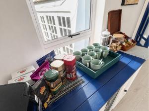a counter with cups and other food items on it at Blues at Bonza Bay Beach in Beacon Bay