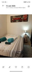 a picture of a bed with two pillows on it at La cabane provençale in Chamaret