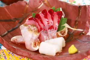 a plate of food with strawberries and other foods at 民宿池田屋 in Taketomi +26 photos