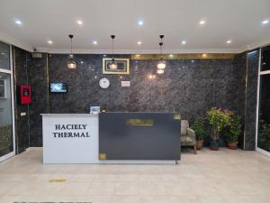 a lobby with a harley thermal sign on a wall at Haciely Thermal Otel in Denizli +67 photos