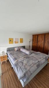a bedroom with a large bed in a room at Halo Apartemen in Kebomas