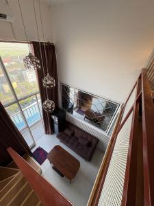 an overhead view of a living room with a table at Halo Apartemen in Kebomas