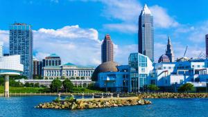 a city skyline with tall buildings and a body of water at Kimpton Schofield Hotel by IHG in Cleveland