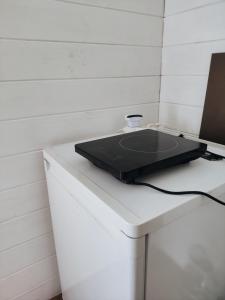 a laptop computer sitting on top of a white counter at Owls' house B&B in Skriaudžiai
