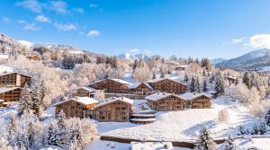 a resort in the mountains covered in snow at Les Chalets de l'Observatoire in Megève