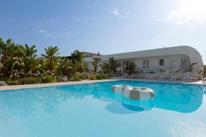 a swimming pool with a slide in front of a building at Residence Stellaris Apartrooms in Termoli