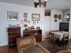 a living room with a table and a dining room at City centar apartman in Zaječar