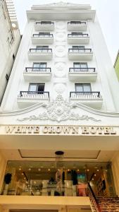 a building with a sign that reads white crown hotel at White Crown Hotel Ha Long in Ha Long