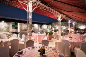 a banquet hall with white tables and white chairs at Holiday Inn Singapore Orchard City Centre by IHG in Singapore +90 photos