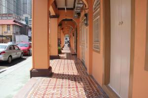 an alley way with an archway on a building at Old Penang Hotel - Trang Road in George Town