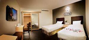 Voodi või voodid majutusasutuse Sky Hotel @ Selayang toas
