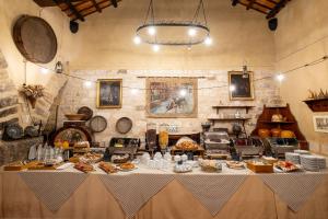 a table with food on it in a room at Agriturismo Duca di Castelmonte in Trapani