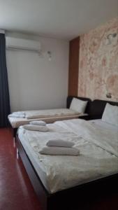 two beds in a room with at Hotel Sliv Elite Events in Blatec