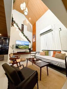 a living room with a couch and a table at Sharma Nosso Canto in Arayat +36 photos
