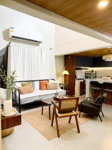 a living room with a couch and a table at Sharma Nosso Canto in Arayat