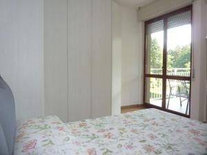 a bedroom with a bed and a large window at BlueVille21 in Germignaga +32 photos