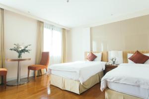 Postel nebo postele na pokoji v ubytování Thomson Residence Hotel + 37 fotografií