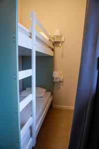 a bunk bed room with two bunk beds in a room at Ô Doubs Chalets in Mouthe