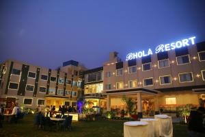 a hotel with a sign that reads attend a resort at Bhola Resort in Soraon